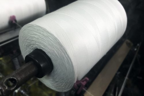 White Polyester Thread On A Machine
